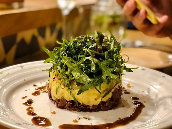 Chef plating a beautifully arranged dish at Le Comptoir Da Nang - Le Comptoir Da Nang - culinary artistry