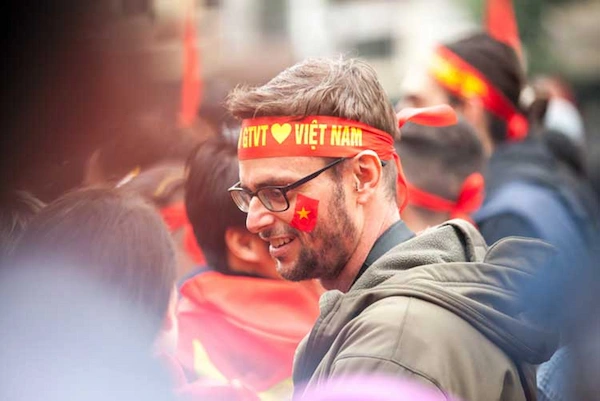 person attending a traditional Vietnamese ceremony 