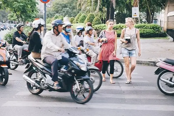 expat-crossing-busy-street-hanoi