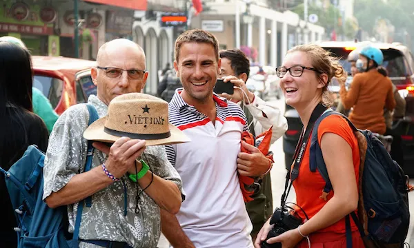  a-expat-group-walking-hanoi-old-quarter.jpg